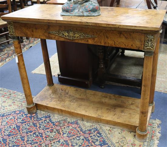 A 19th century burr elm console table with brass mounts W.113cm.